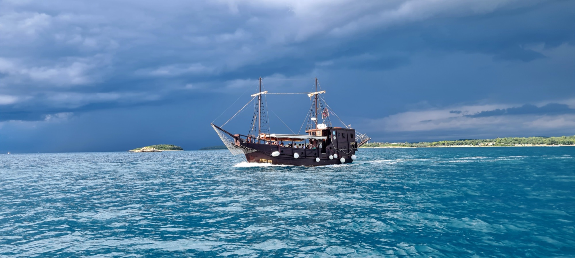 Sveta Ana sailing under dramatic clouds